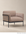 Scribe Lounge Chair | Fabric by Wooden Stories, a Bauhaus-inspired armchair with taupe fabric upholstery and a black metal frame.