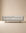A light beige, low-profile Sonder Sofa | Fabric with thin armrests and light-colored wooden legs from the Danish collection.