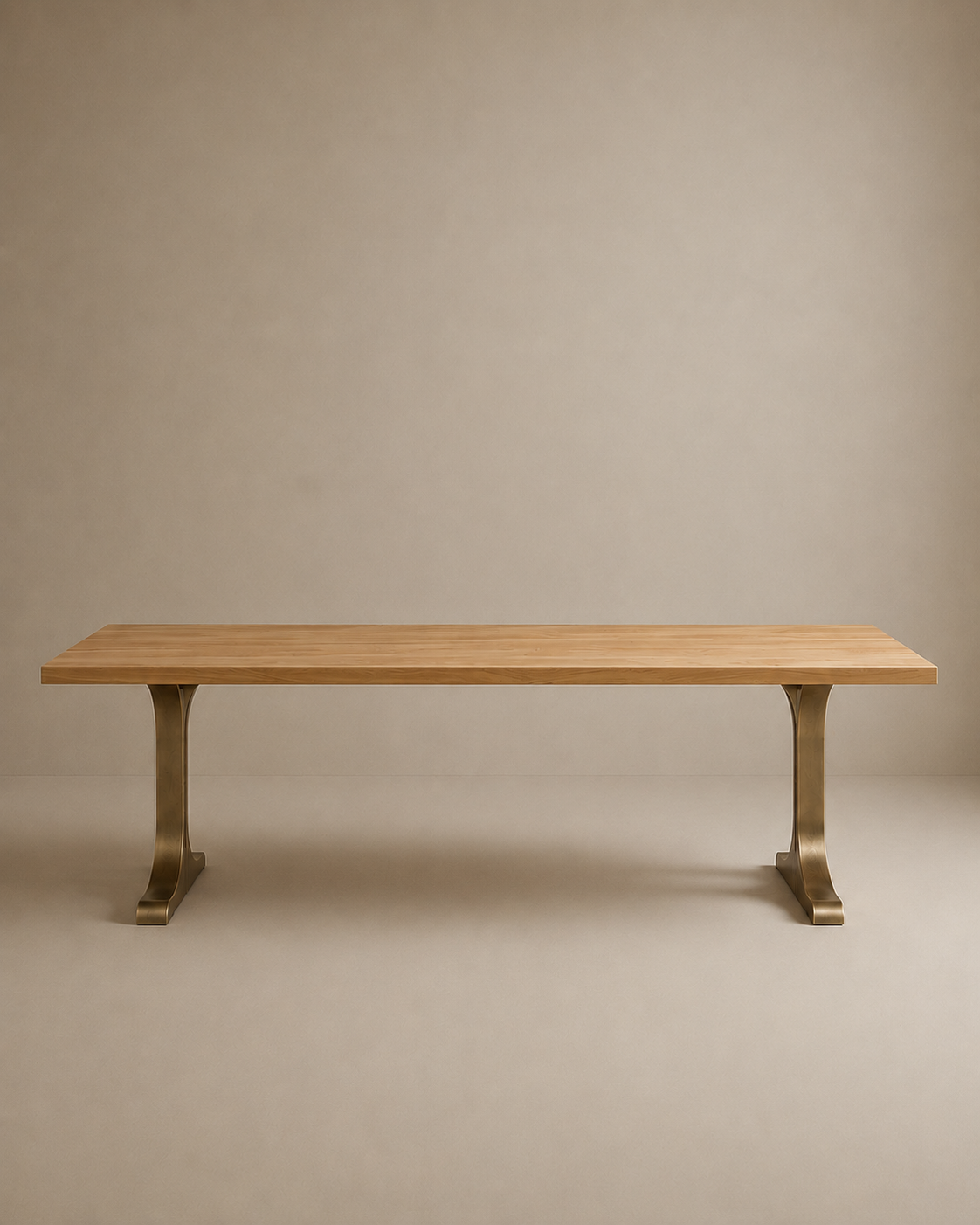The Tommaso Dining Table by SOBU features a rectangular, modern design with a smooth solid wood surface and two brass T-shaped metal pedestal legs, showcased against a plain beige background.