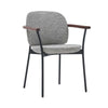 The Solace Dining Armchair | Fabric by Wooden Stories features a gray upholstered seat and backrest, black metal legs, and wooden armrests—a minimalist, contemporary design ideal for modern spaces.