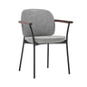 The Solace Dining Armchair | Fabric by Wooden Stories features a gray upholstered seat and backrest, black metal legs, and wooden armrests—a minimalist, contemporary design ideal for modern spaces.