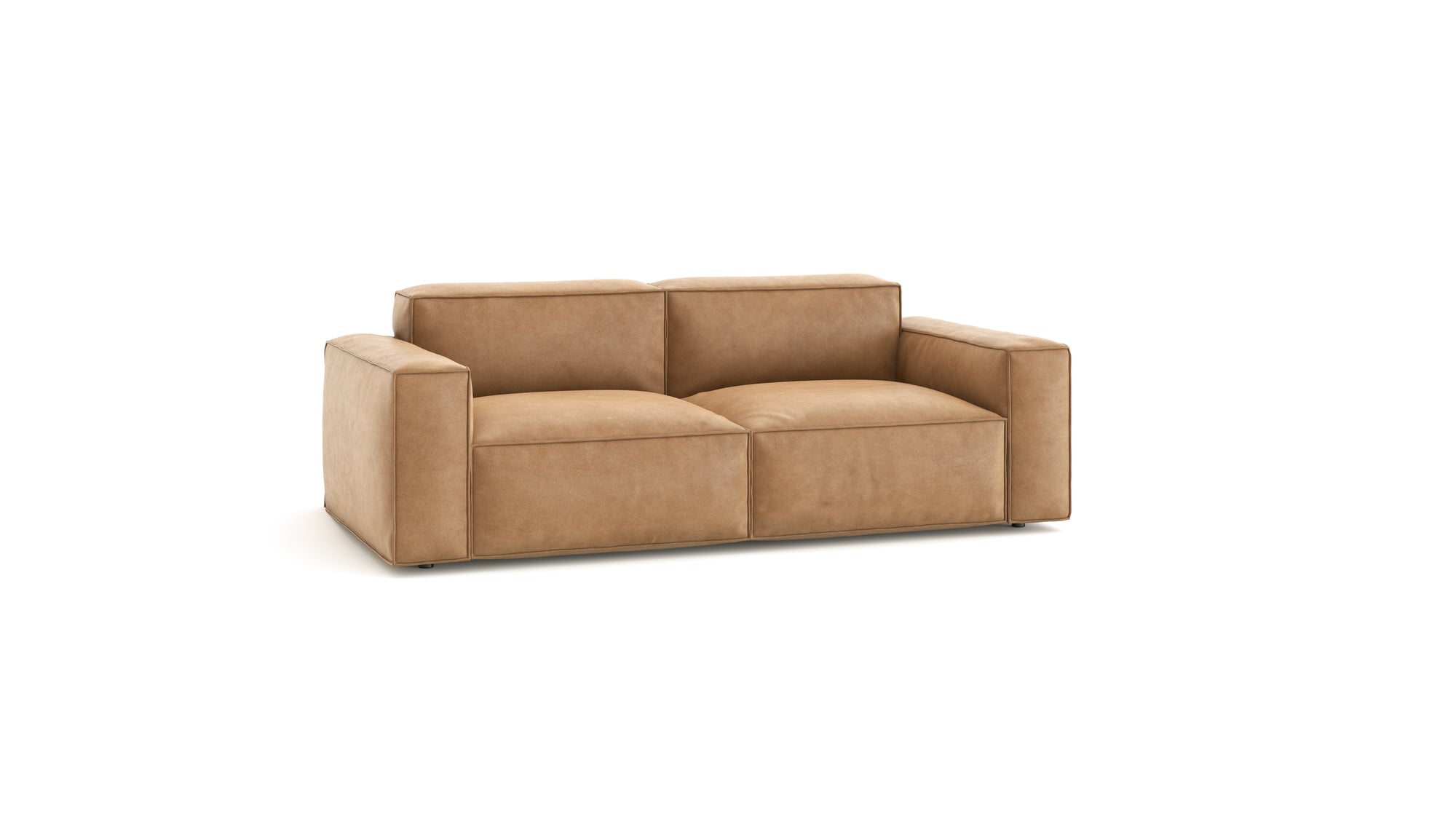 The Baker Sofa | Leather by Wooden Stories features wide armrests and plush light brown leather cushions, offering modern comfort and style against a white background.