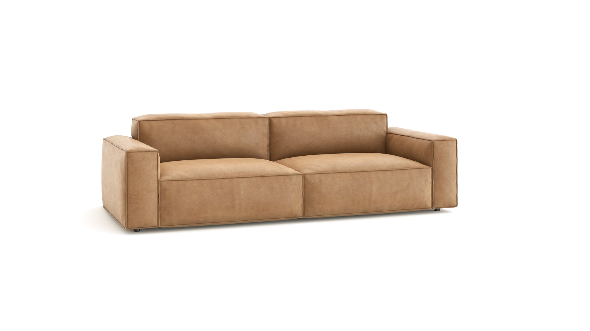 The Baker Sofa | Leather by Wooden Stories is a modern tan leather sofa with wide armrests and seat cushions, featuring a minimalist design—ideal for any contemporary setting.
