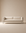 The Sonder Sofa | Fabric by Wooden Stories, showcasing Danish-inspired lines, a linear frame, and slim black legs in modern beige upholstery, is centered against a matching beige background to create a minimalist and neutral setting.
