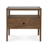 The Spindle Nightstand - Teak by Ethnicraft is crafted from FSC-certified teak and features four legs, a glass top, an open shelf, and a single drawer with a round hole handle.