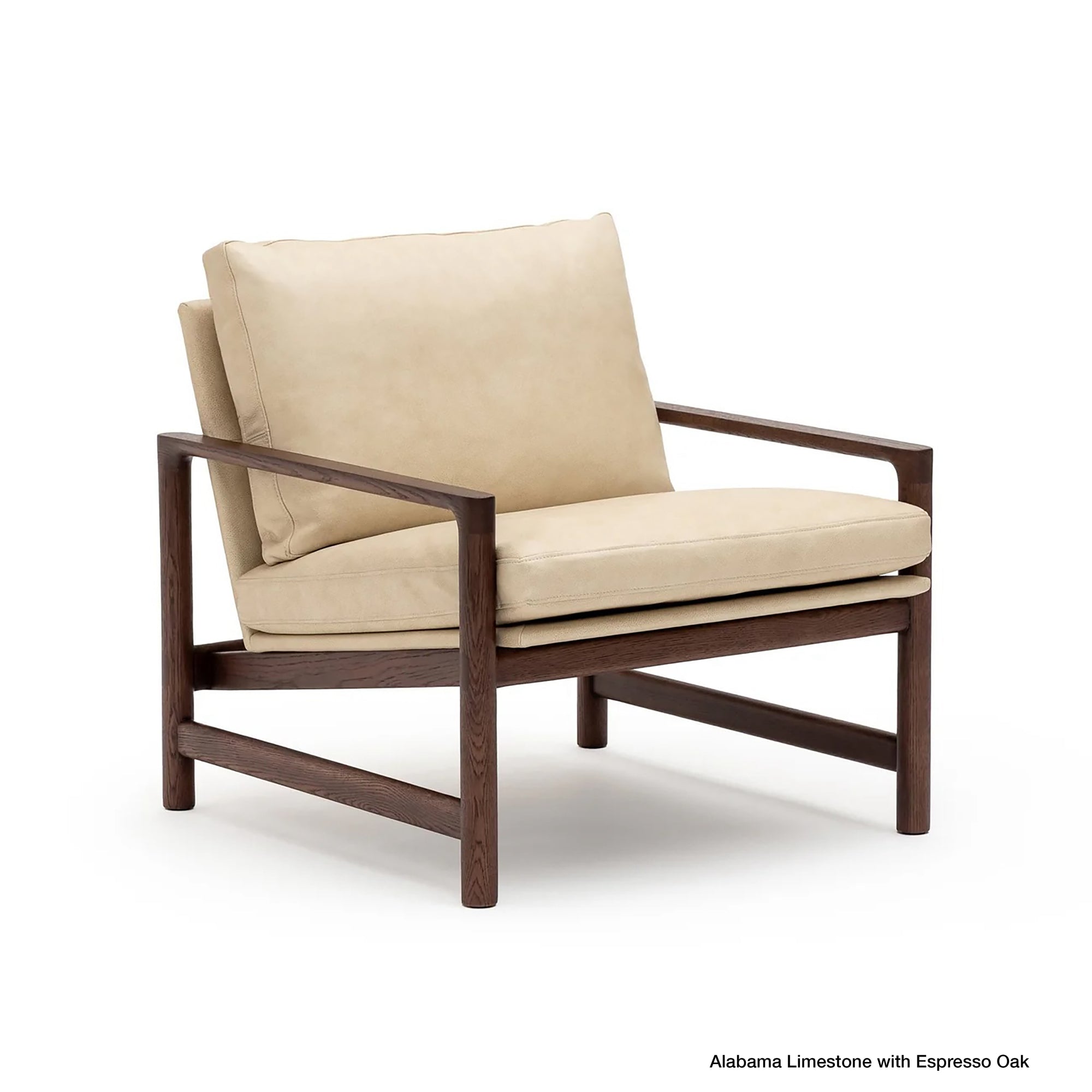 A contemporary Troubadour Lounge Chair from Wooden Stories, featuring Alabama Limestone leather cushions and a sturdy Espresso Oak frame with wide armrests and a minimalist design.