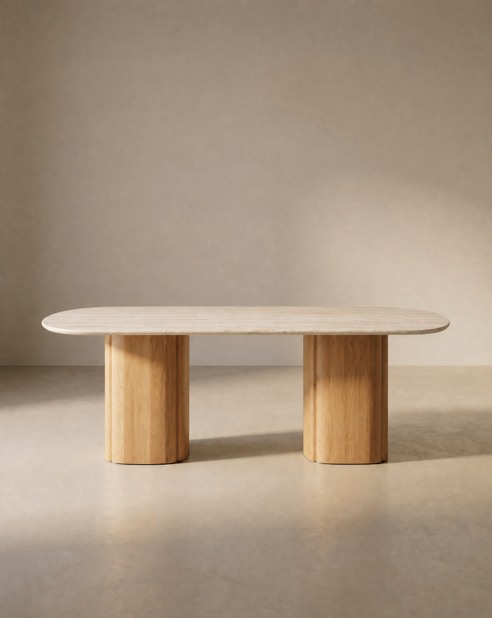 The Tathra Ellipse Dining Table by Wooden Stories features a minimalist stone oval top and two solid oak cylindrical legs, reflecting European craftsmanship against a neutral beige background.