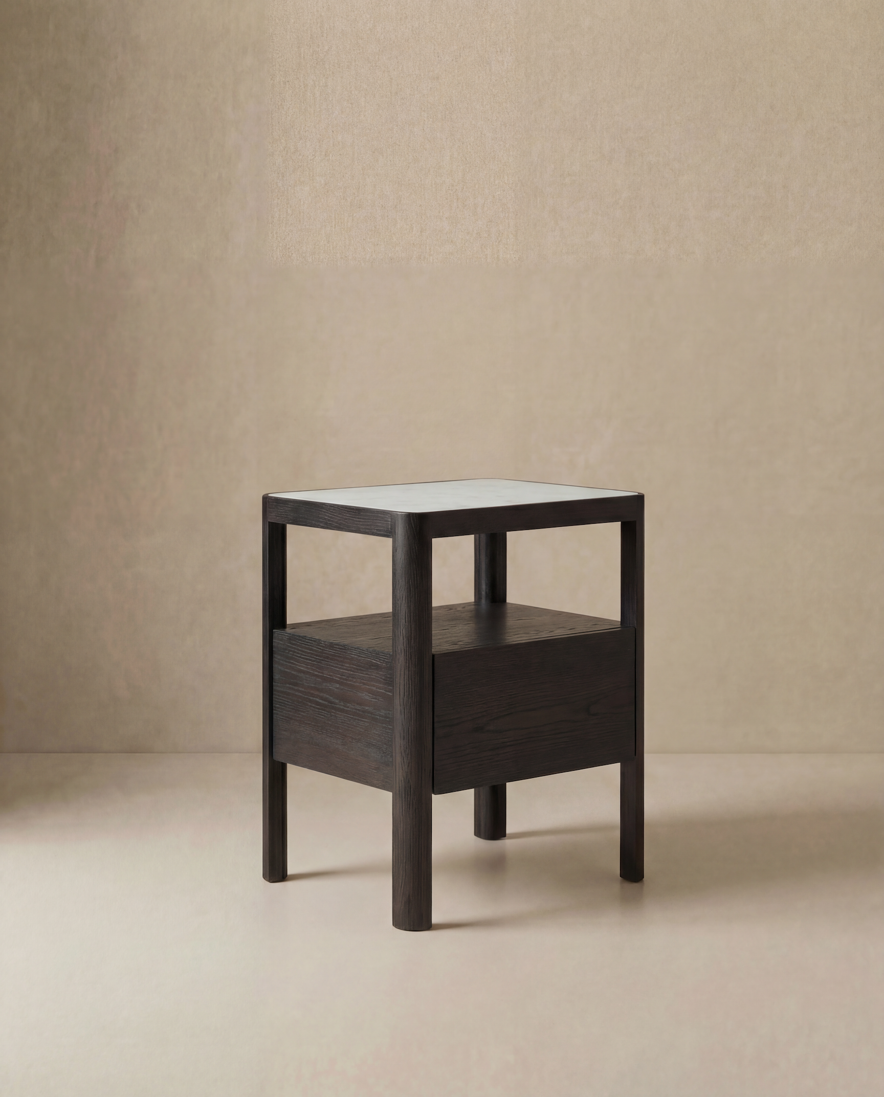 The Theo Nightstand by Wooden Stories is a minimalist dark wood side table with Danish lines, featuring a square top, four sturdy legs, and a lower shelf, shown on a light floor against a plain beige wall.