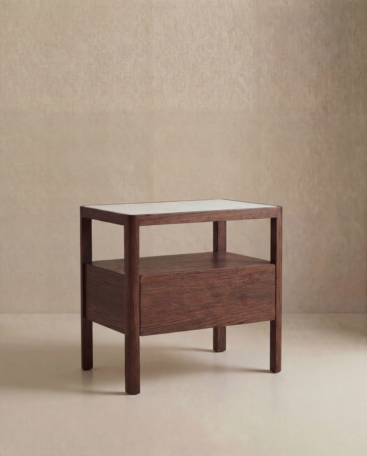 The Theo Nightstand Wide by Wooden Stories, a modern wooden side table with Danish lines, features a drawer and open shelf, and stands on four legs against a neutral beige background.