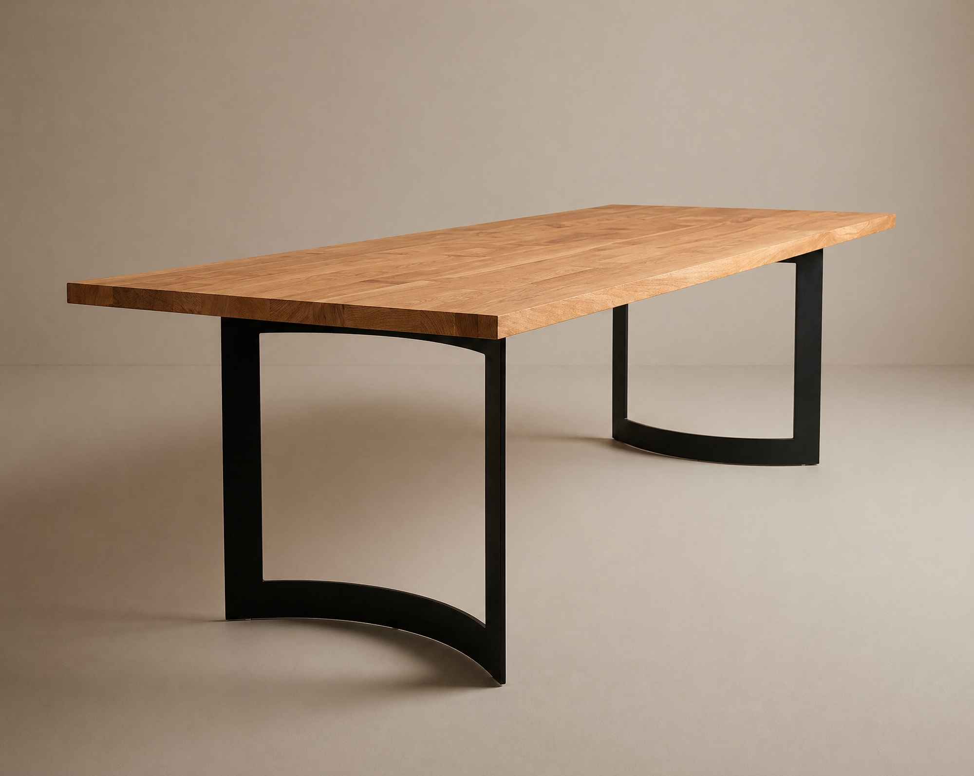 The SOBU Tommaso Dining Table features a modern solid wood top with a natural finish and curved black metal legs, displayed against a plain beige background.
