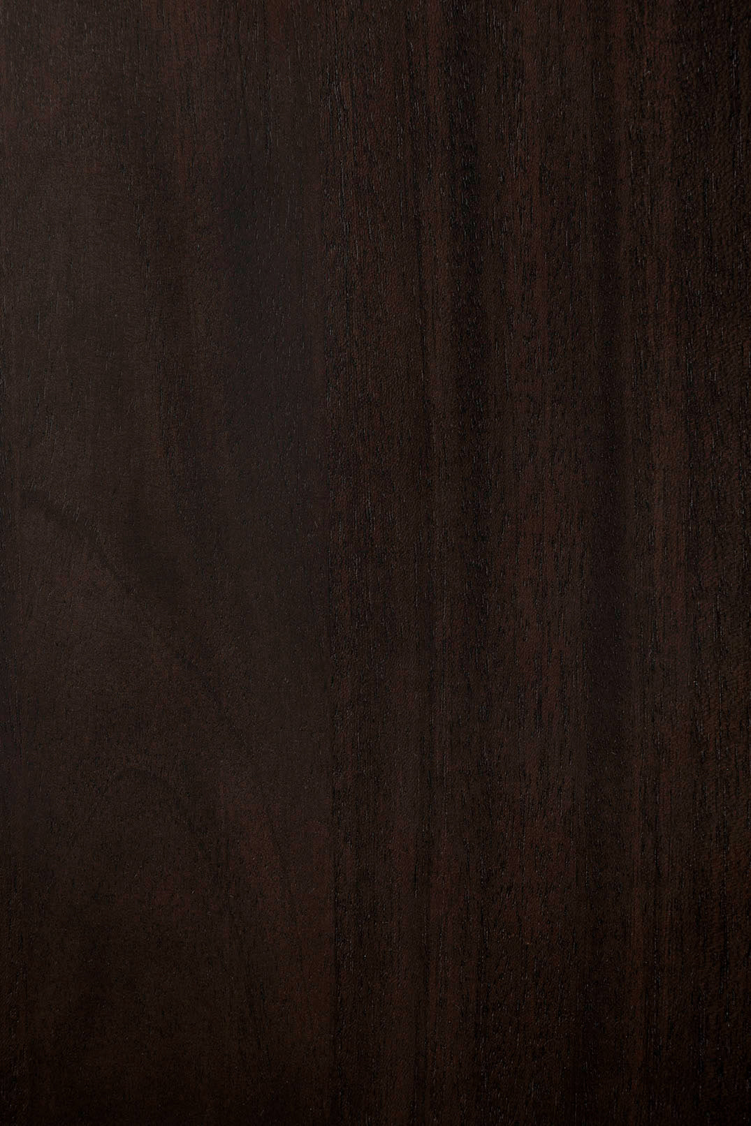 The Eda Coffee Table by Ethnicraft features a dark brown wooden surface with subtle grain patterns and a matte finish, highlighting the refined European craftsmanship characteristic of the brand.