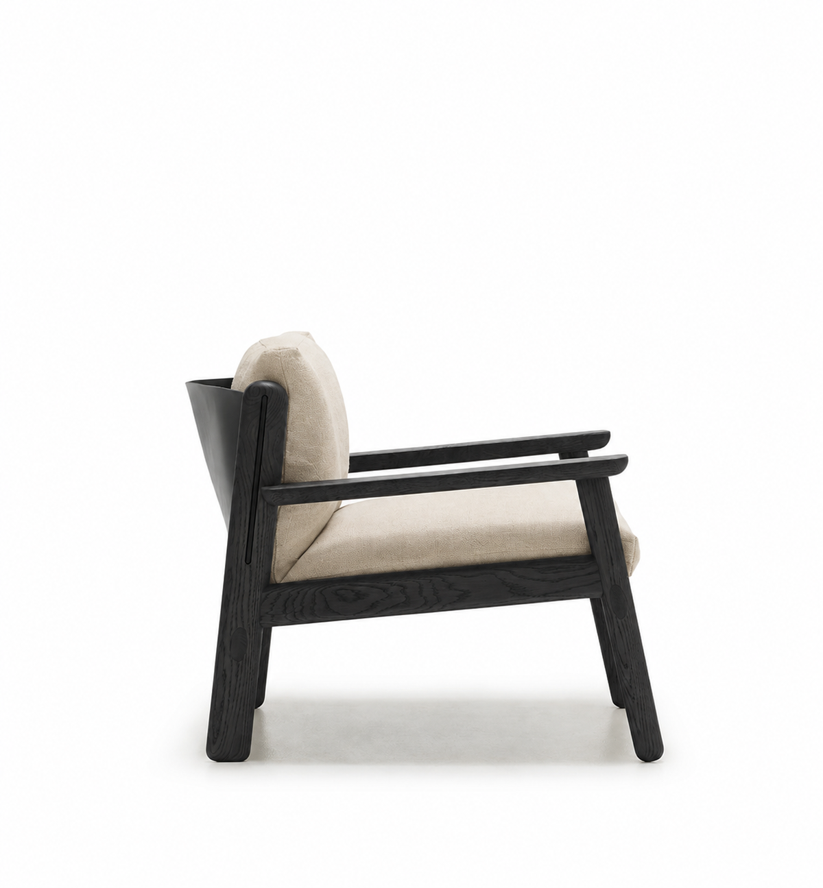 The Wren Lounge Chair | Fabric by Wooden Stories is a modern armchair inspired by Danish design, featuring a black wooden frame and light beige fabric cushions, shown in a side view against a plain white background.