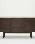 The Wooden Stories Yorke Sideboard with Stone Top features Danish-inspired lines, three cabinet doors, and a light marble top, displayed against a plain white background.