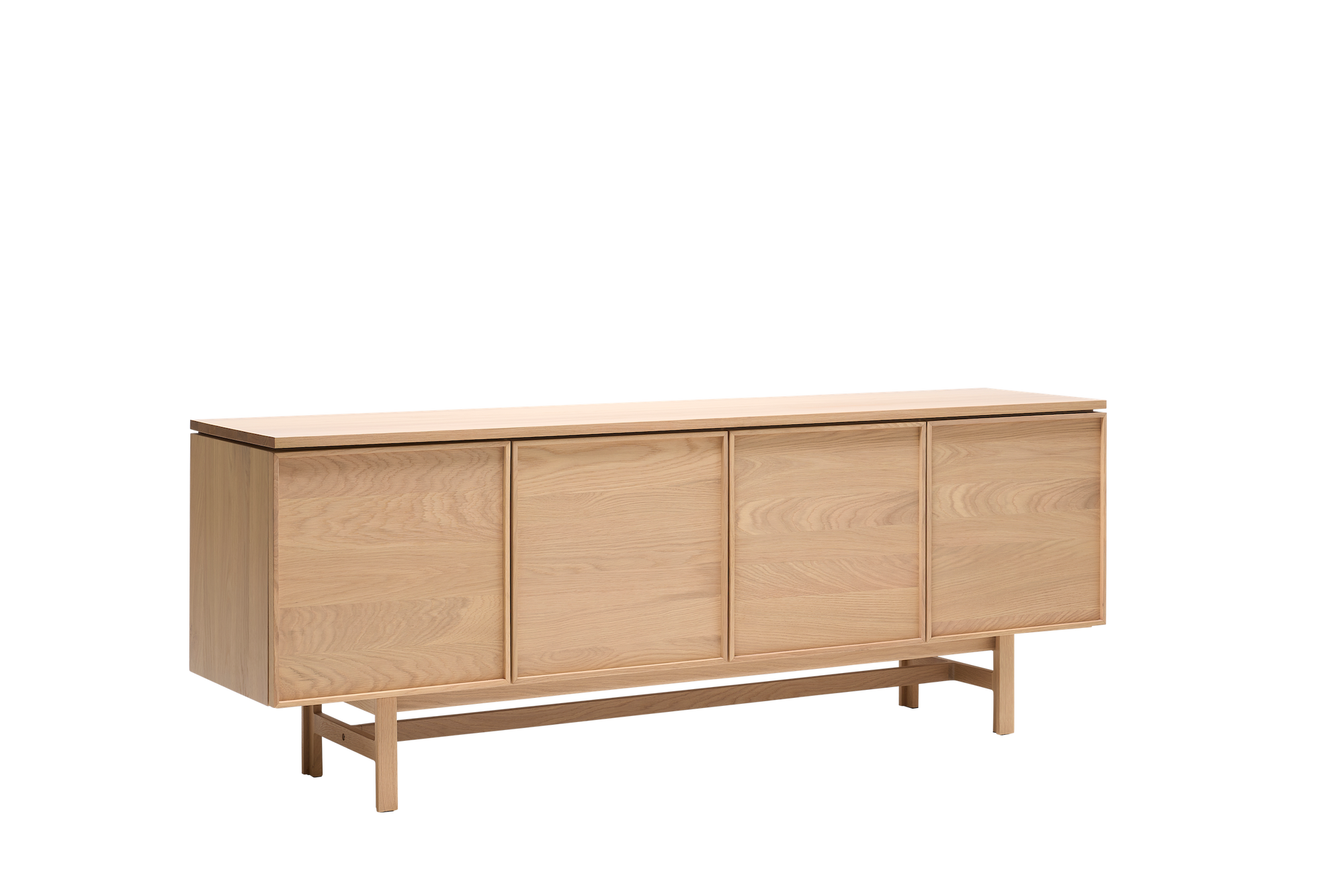 The Yorke Sideboard by Wooden Stories features four doors, clean minimalist lines, and raised legs—an elegant solid oak piece inspired by classic Scandinavian design.