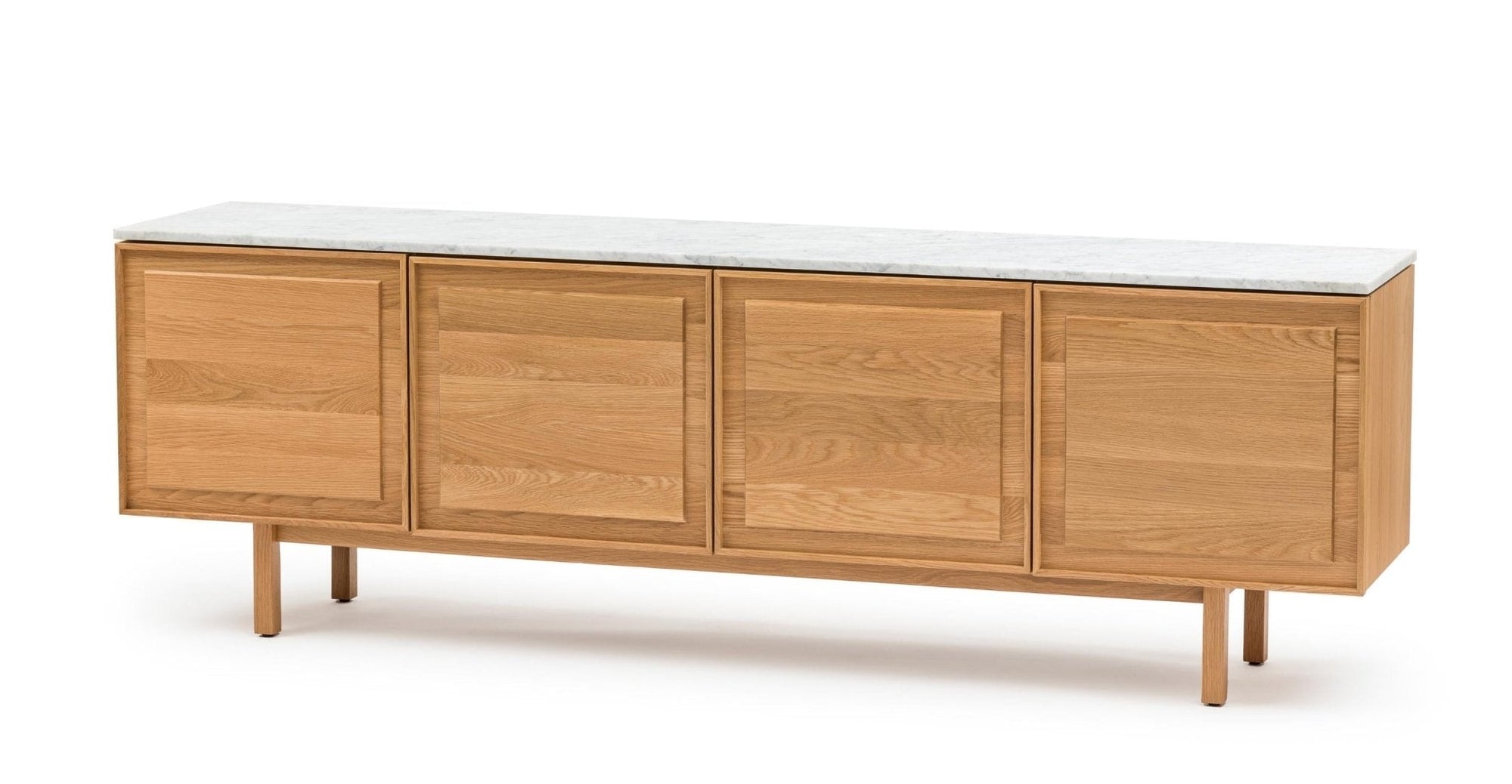 The Yorke Sideboard with Stone Top by Wooden Stories features four paneled doors, a modern design, white stone top, and slender legs with elegant Danish lines.