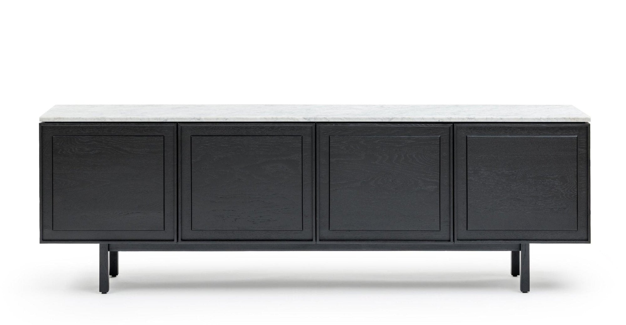 The Wooden Stories Yorke Sideboard with Stone Top features Danish-inspired black wood, four cabinet doors, a sleek white stone top, and slim black legs, shown against a white background.