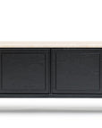 The Yorke Sideboard with Stone Top by Wooden Stories features four black paneled doors, a light-colored stone top, and slim black legs, showcasing modern Danish lines.