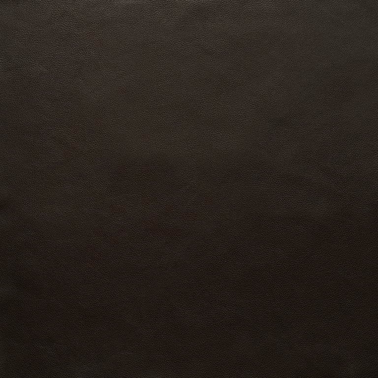 A close-up of dark brown leather with a natural grain texture from Wooden Stories Fabric + Leather Swatches. Explore custom made-to-order options and browse fabric swatches to find your perfect piece.