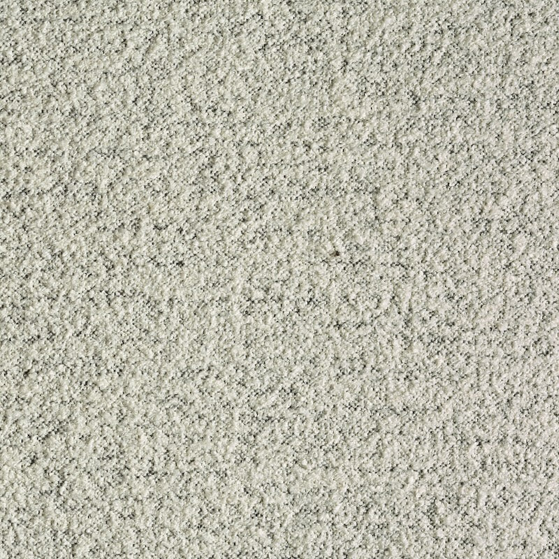 Close-up of a textured white surface with a rough, grainy look—an ideal inspiration for Wooden Stories Fabric + Leather Swatches and custom made-to-order designs.