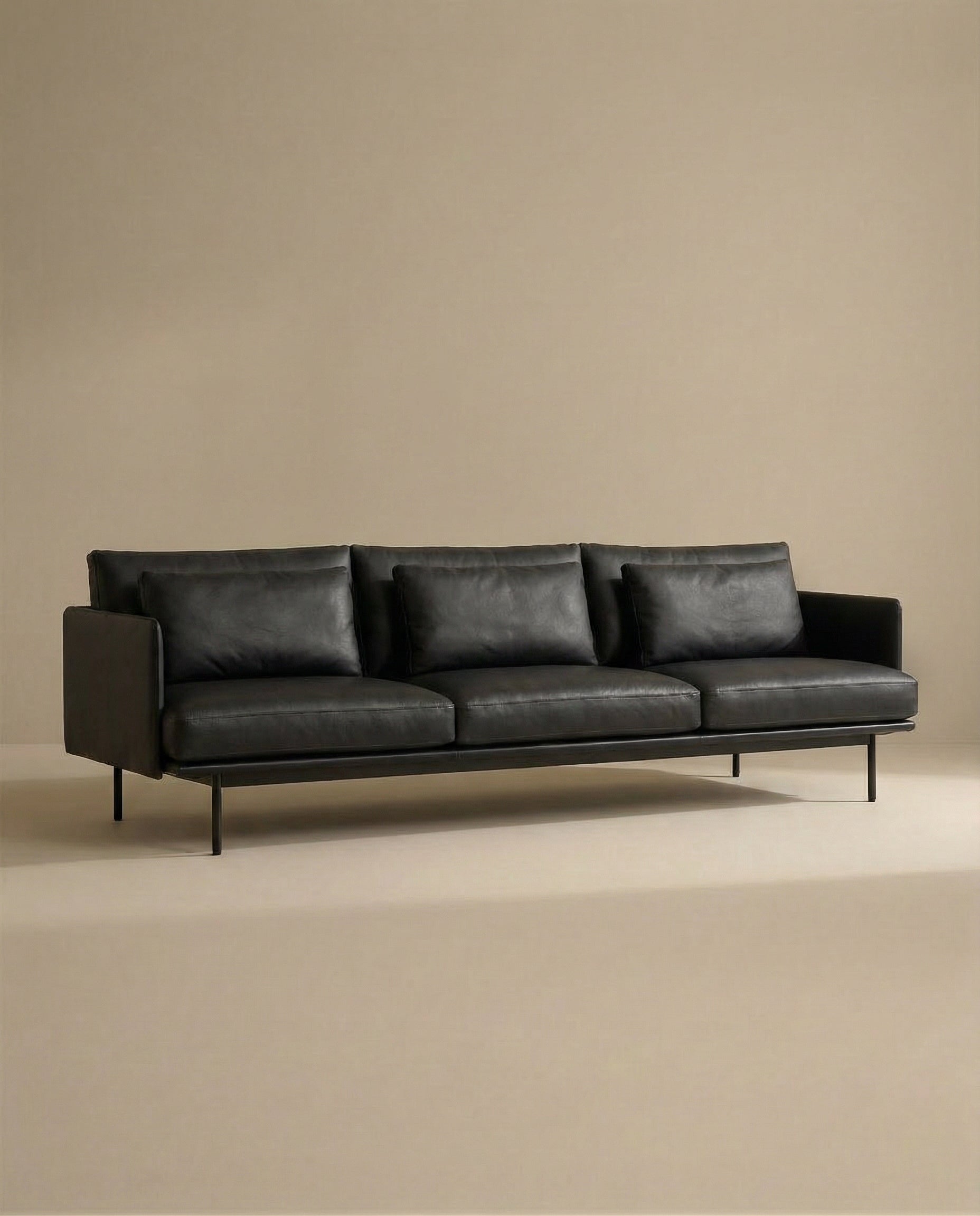 The SOBU Cherry Sofa | Leather is a modern black 3-seater with Danish-inspired lines, three seat cushions, three backrest pillows, and sleek metal legs—ideal for stylish contemporary living spaces.