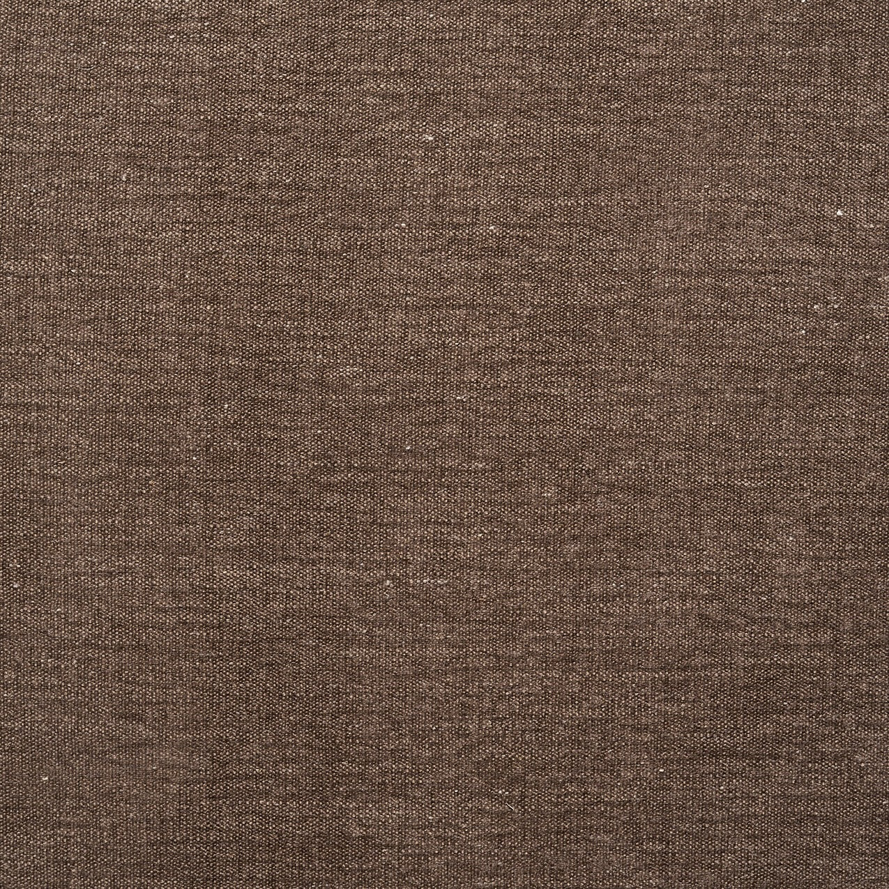 A close-up of brown textured fabric from Natadora + Tolv’s Material Swatches highlights its woven pattern and fine threads, offering a natural, rustic look—ideal for swatches or custom made-to-order projects.
