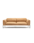 The Department Sofa 81" by Wooden Stories features tan leather, Danish-inspired lines, a low back, wide armrests, and slim black metal legs, shown against a plain white background.