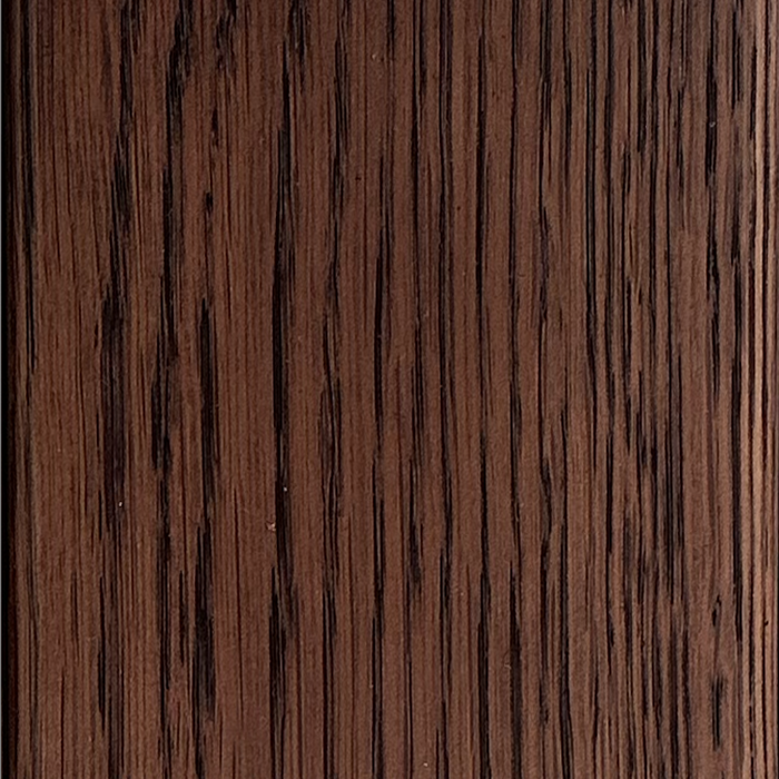 Close-up of Material Swatches by Natadora + Tolv, showcasing a dark brown finish with natural vertical grain and subtle texture—ideal for swatches and design inspiration.