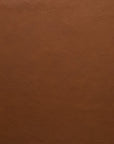 A close-up of smooth, brown leather from Wooden Stories' Fabric + Leather Swatches, showing natural creases and grains—ideal for custom orders or comparing textures.