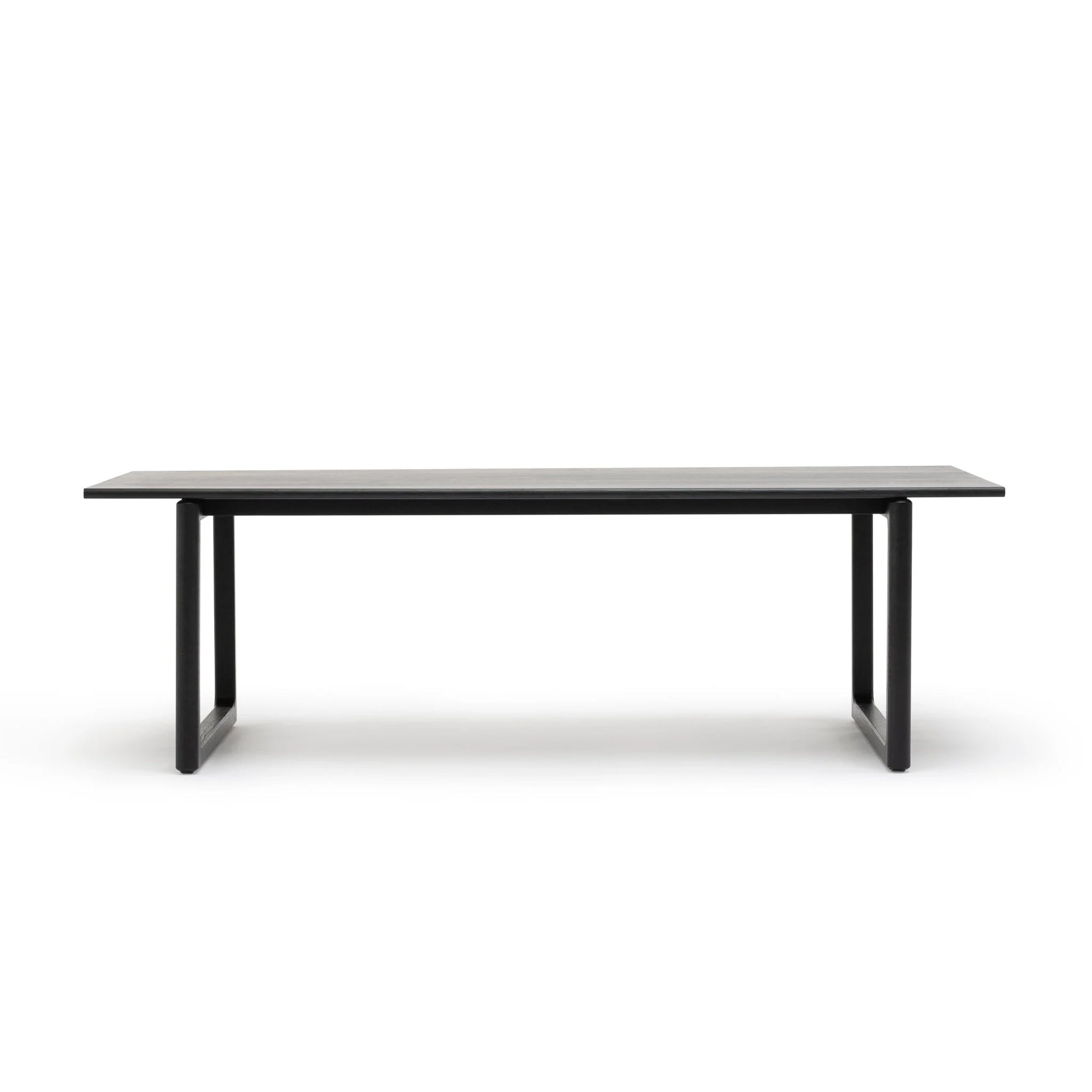 The Hover Dining Table | Black Oak by Wooden Stories boasts a modern, minimalist rectangular design with Danish lines, a flat top, and two wide legs—ideal for any dining room. Photographed against a plain white background.