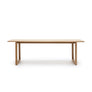 The Hover Dining Table by Wooden Stories is a minimalist, rectangular light oak table with sleek Danish lines and two sturdy end supports. Perfect for dining rooms, it's photographed against a plain white background.