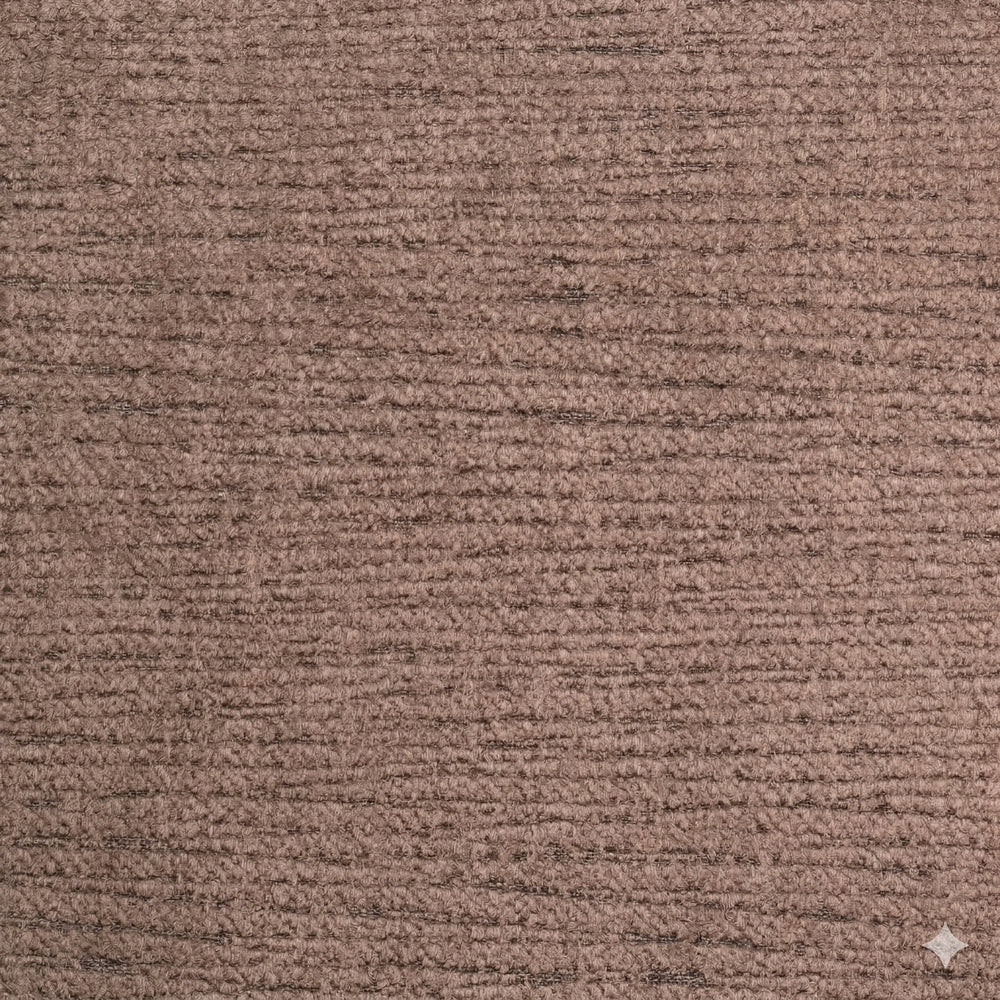 Close-up of SOBU’s Material Swatches, featuring a brown textured carpet sample from the Danish Collection. The surface displays visible horizontal lines and a soft, slightly rough texture. A small white diamond-shaped tag in the bottom right corner highlights one of the high-quality materials available from the SOBU Material Swatches selection.