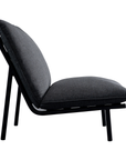 Side view of the Morgan Outdoor Chair by Moes, featuring a sleek black stainless-steel frame and thick dark gray seat and back cushions, set against a plain white background.