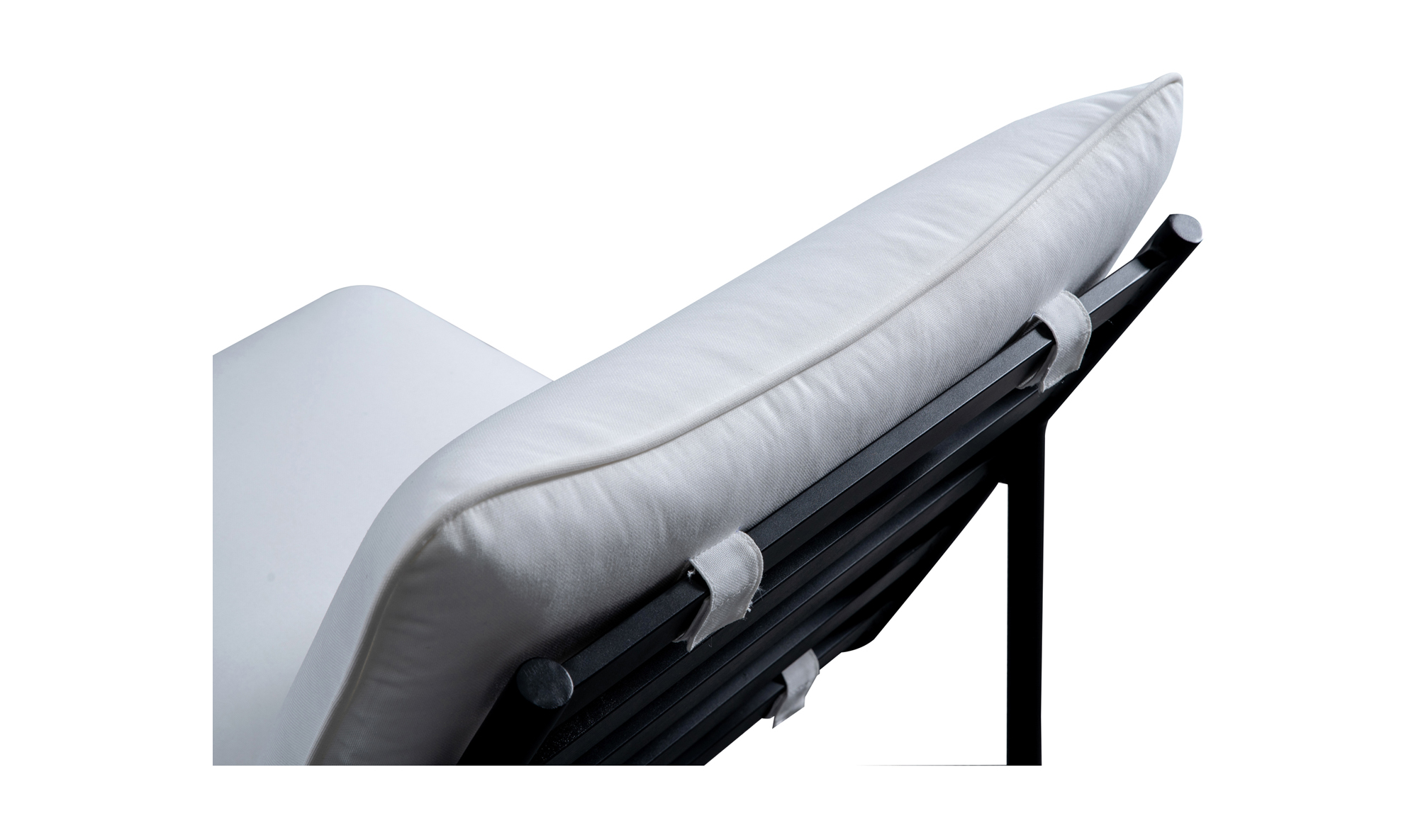 Close-up of the Moes Morgan Outdoor Chair featuring a white Olefin cushioned seat and backrest on a black metal frame, highlighting its angled design and fastening straps.