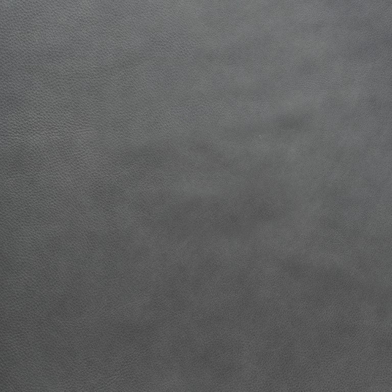 A close-up of the dark gray, textured leather from Wooden Stories’ Fabric + Leather Swatches—highlighting subtle color variations and natural grain, ideal for choosing swatches or custom pieces.