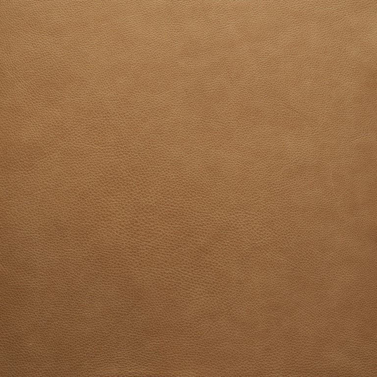 Close-up of a smooth, light brown leather surface from Wooden Stories&#39; Fabric + Leather Swatches, showcasing fine natural grain and a slightly pebbled look—ideal for custom made-to-order swatches.