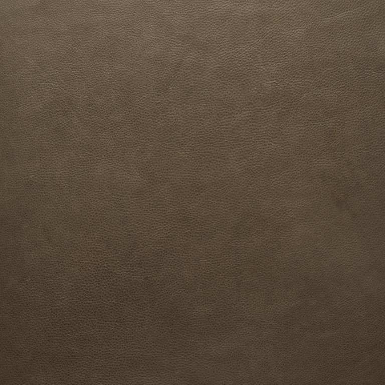 Close-up of Wooden Stories&#39; Fabric + Leather Swatches, showing a brown, slightly textured surface. The fine, uniform texture evokes premium fabric swatches with a smooth yet subtly pebbled leather-like appearance.