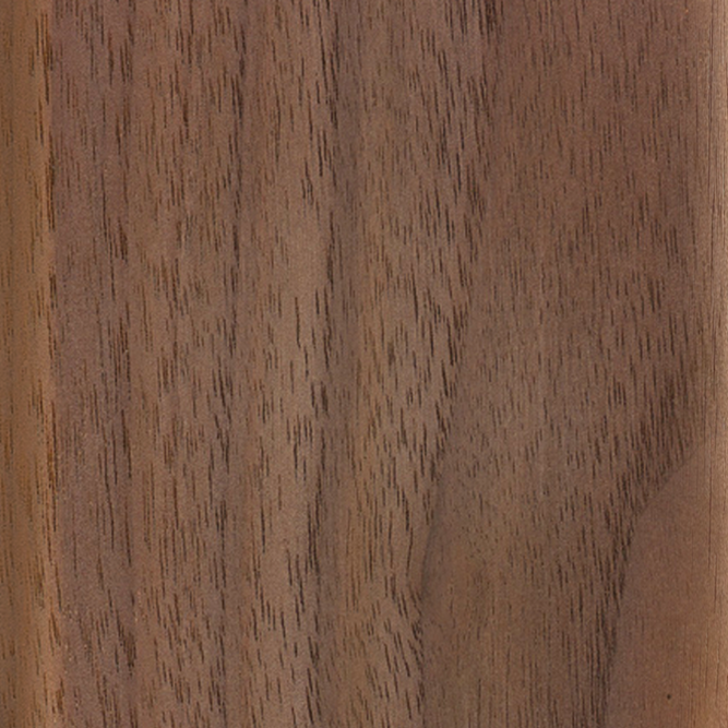 Close-up of Material Swatches by Natadora + Tolv, showcasing smooth brown wood with natural grain patterns, fine dark lines, and lighter patches for an organic look.