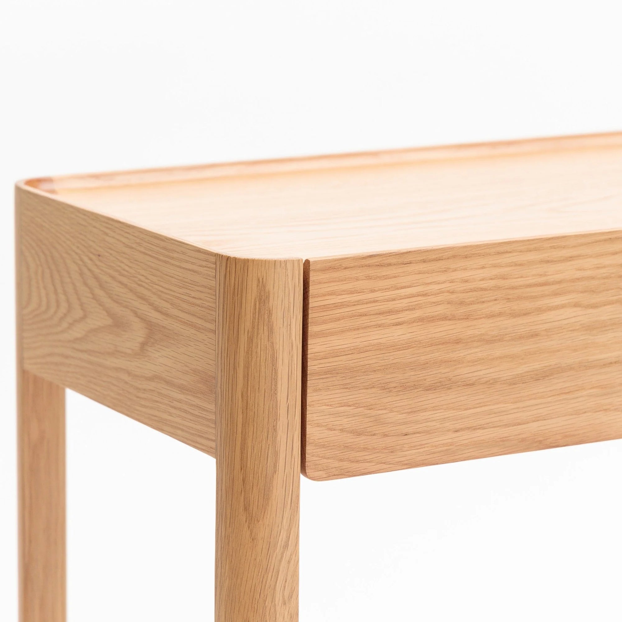 Close-up of the Nell Console | Light Oak by Wooden Stories, featuring smooth edges and minimalist Danish design, set against a plain white background.