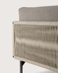 Close-up of the Ethnicraft Corbey Outdoor Sofa, featuring woven beige rope side panels, a gray cushion backrest, and black metal legs—ideal for enhancing your outdoor space against a simple light background.