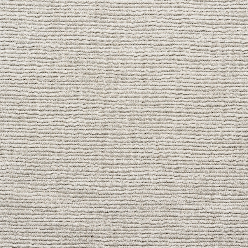 Close-up of a light gray textured carpet from SOBU’s Material Swatches, featuring evenly spaced horizontal ridges across the surface that create a subtle striped pattern and highlight the quality of the materials.
