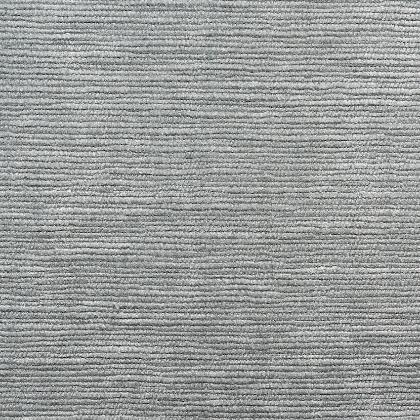 Close-up of a gray textured carpet from SOBU’s Material Swatches collection, featuring horizontal, evenly spaced ridges and a soft, woven appearance. The consistent pattern highlights the high-quality materials used across the surface.