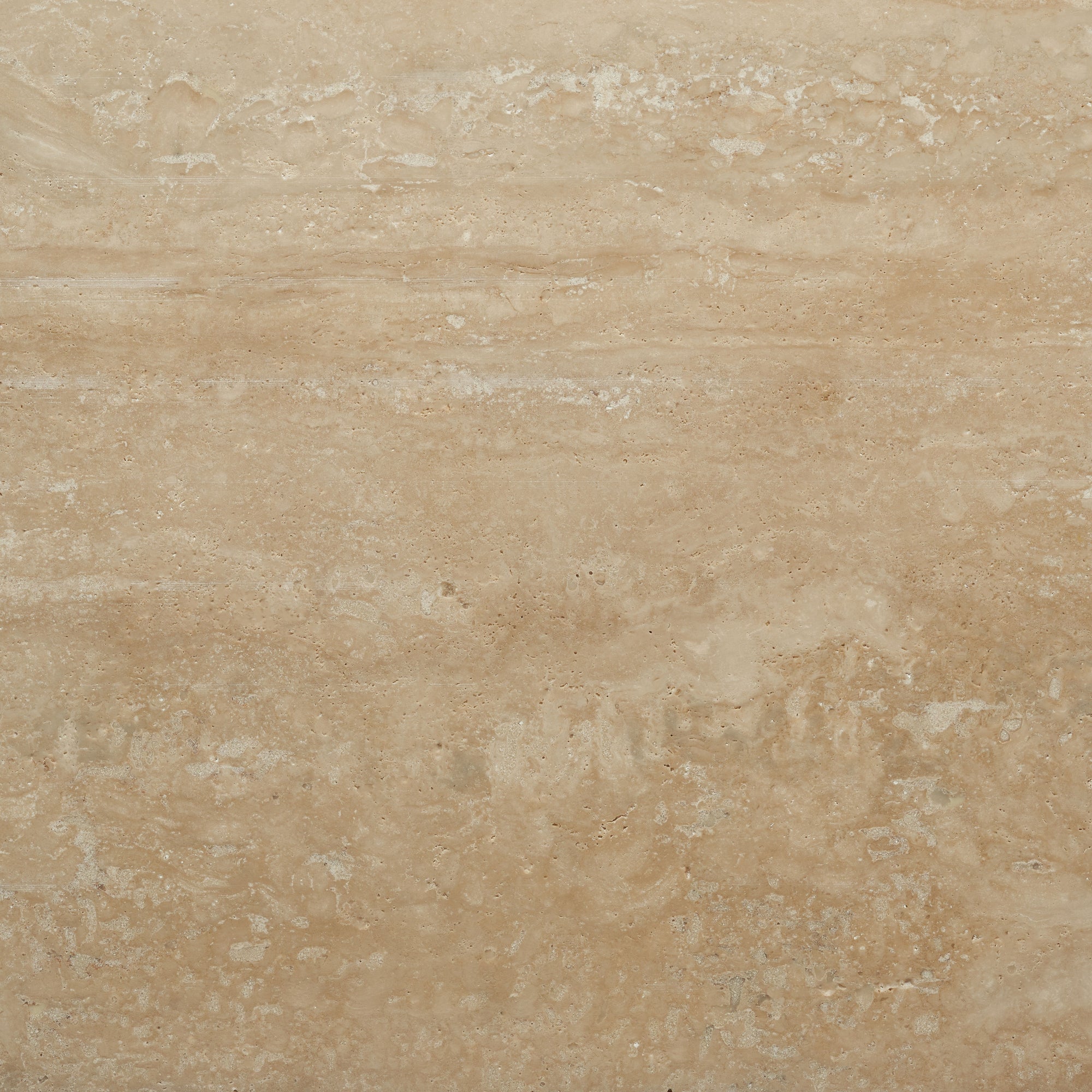 Beige travertine stone with natural variations, subtle veins, and textured light brown and cream patterns. Perfect for Material Swatches by Natadora + Tolv, this look enhances refined interior styles.