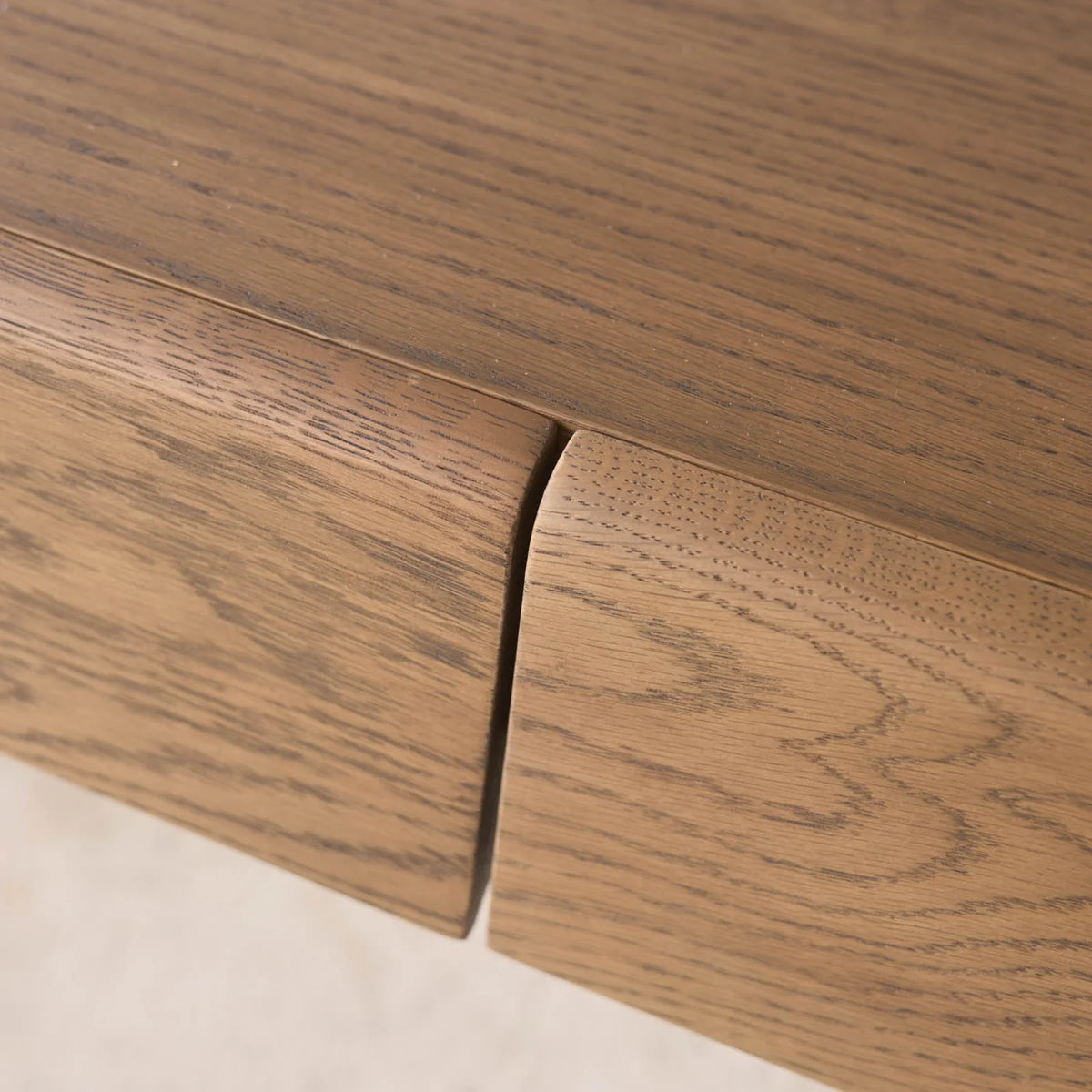 Close-up of the Nell Console | Latte Oak by Wooden Stories, highlighting two adjoining drawers with a natural solid oak wood grain texture and a smooth, modern finish in a light latte oak color inspired by Scandinavian design.