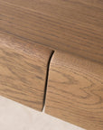 Close-up of the Nell Console | Latte Oak by Wooden Stories, highlighting two adjoining drawers with a natural solid oak wood grain texture and a smooth, modern finish in a light latte oak color inspired by Scandinavian design.