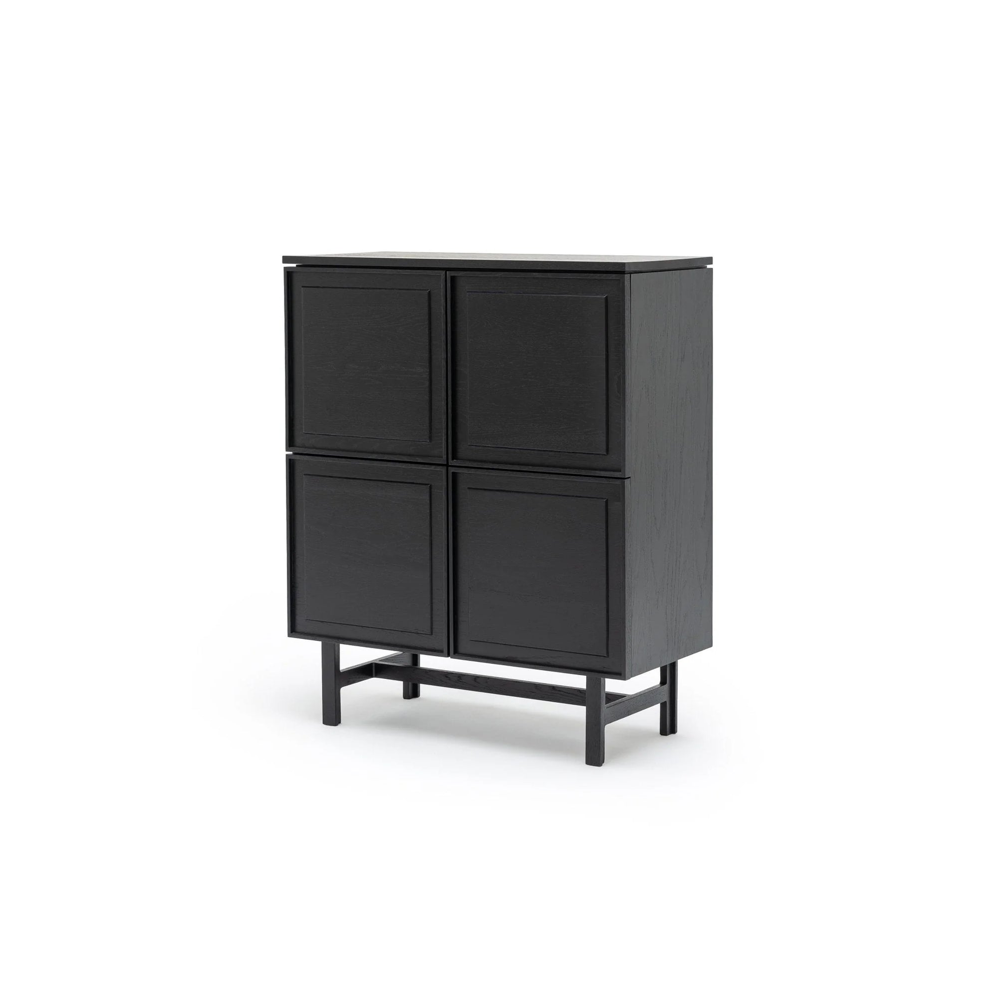 The Yorke Highboard by Wooden Stories is a modern black Scandinavian piece with four square doors and clean lines, elevated on short legs, set against a plain white background.