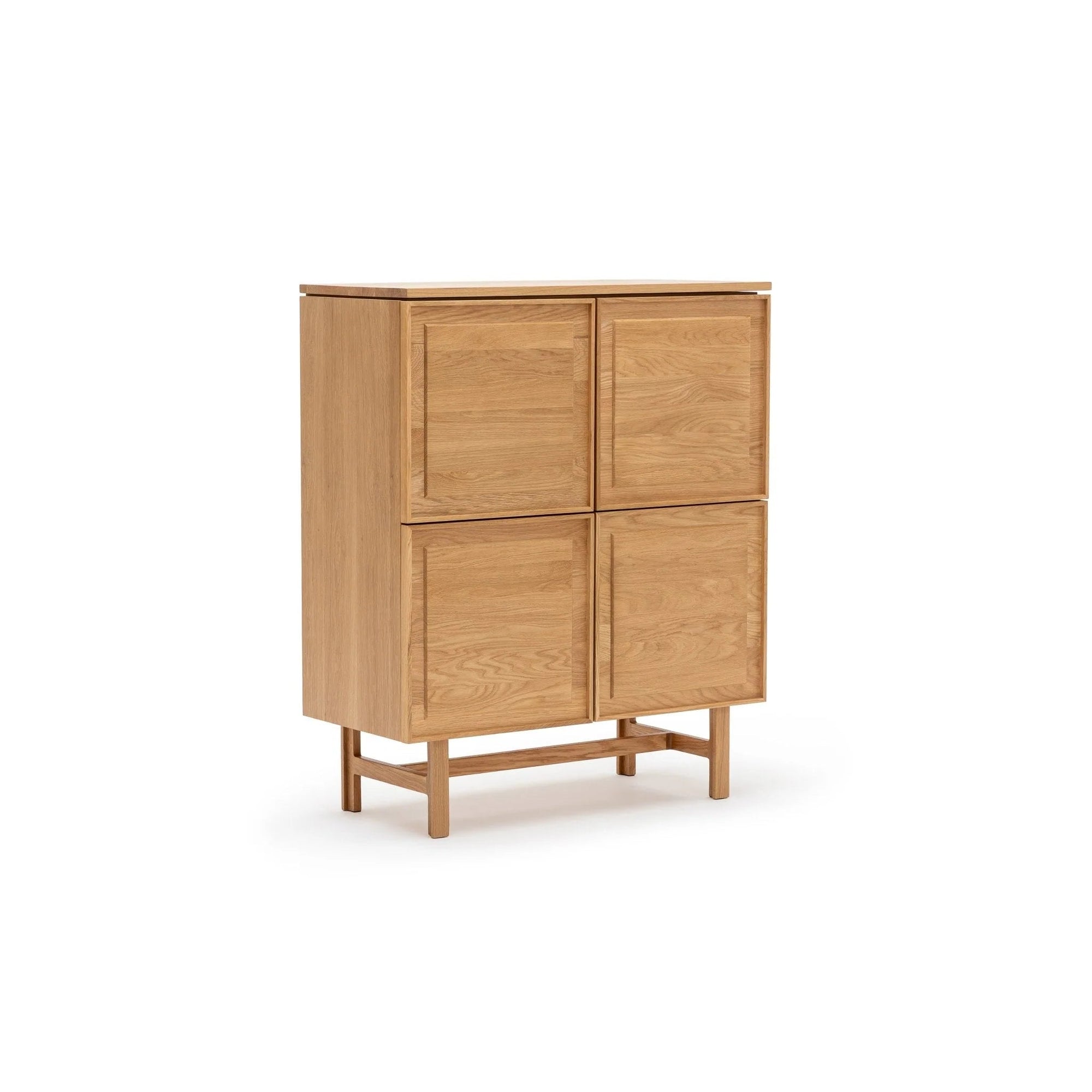 The Wooden Stories Yorke Highboard is a Scandinavian-style light wood piece with four square doors, clean lines, and four straight legs, shown against a white background.