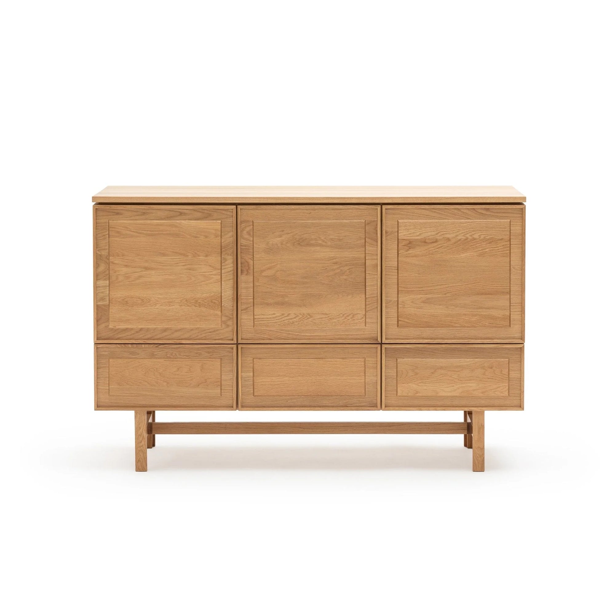 The Yorke Highboard by Wooden Stories is a Scandinavian piece in solid oak with a natural finish, featuring three cabinet doors and three horizontal drawers on a rectangular base with short legs.