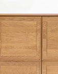 A close-up of the Yorke Highboard by Wooden Stories—a minimalist cabinet with four square doors, light natural wood finish, and sleek panel detailing—showcasing Danish design elegance against a plain white background.